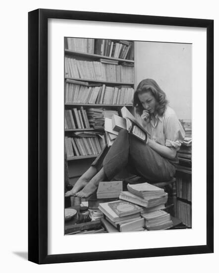 French Actress Barbara Laage, Alone in Her Apartment Reading-Nina Leen-Framed Photographic Print