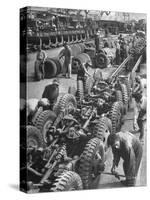 French Army Mechanics Busy Assembling Tires on the Chassis of 3/4 Ton American Made Army Trucks-Margaret Bourke-White-Stretched Canvas