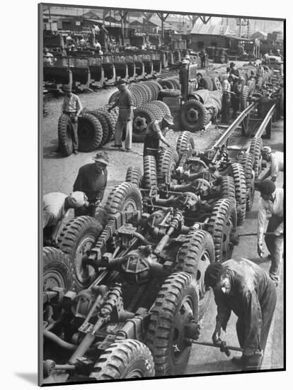 French Army Mechanics Busy Assembling Tires on the Chassis of 3/4 Ton American Made Army Trucks-Margaret Bourke-White-Mounted Photographic Print
