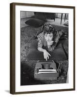 French Authoress Francoise Sagan, Laying on the Floor Typing-Thomas D^ Mcavoy-Framed Premium Photographic Print