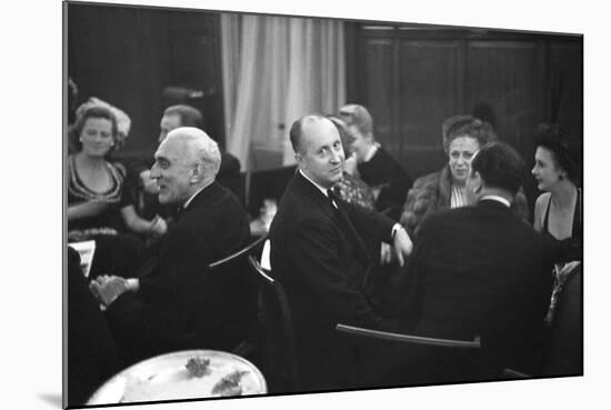 French Designer Christian Dior Drinking with Unidentified Others at a Bar, Paris, November 1947-Frank Scherschel-Mounted Photographic Print