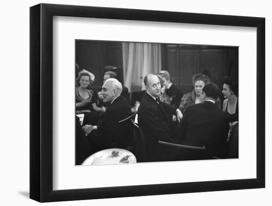 French Designer Christian Dior Drinking with Unidentified Others at a Bar, Paris, November 1947-Frank Scherschel-Framed Photographic Print