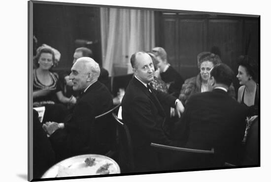 French Designer Christian Dior Drinking with Unidentified Others at a Bar, Paris, November 1947-Frank Scherschel-Mounted Photographic Print