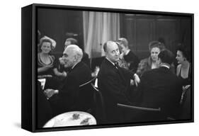 French Designer Christian Dior Drinking with Unidentified Others at a Bar, Paris, November 1947-Frank Scherschel-Framed Stretched Canvas