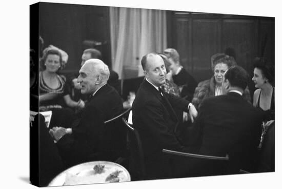 French Designer Christian Dior Drinking with Unidentified Others at a Bar, Paris, November 1947-Frank Scherschel-Stretched Canvas