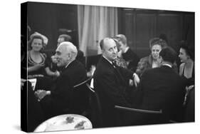 French Designer Christian Dior Drinking with Unidentified Others at a Bar, Paris, November 1947-Frank Scherschel-Stretched Canvas