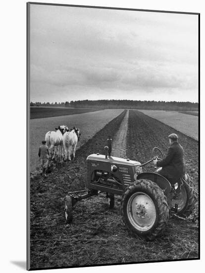 French Farmer Georges Raoul Fremond Trying Out His New Massey-Harris Tractor Obtained Through Eca-null-Mounted Photographic Print