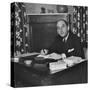 French Journalist Fernand De Brinon Sitting at His Desk-null-Stretched Canvas