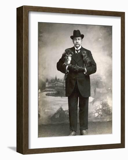 French Man in a Black Suit with a Pekingese Dog Under Each Arm-null-Framed Photographic Print