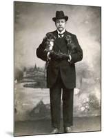 French Man in a Black Suit with a Pekingese Dog Under Each Arm-null-Mounted Photographic Print