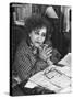 French Novelist Colette, at Desk Covered with Handwritten Notes Topped by Reading Glasses at Home-David Scherman-Stretched Canvas