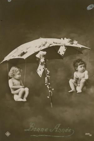 Happy New Year Card with Two Babies Hanging from an Umbrella, Sent in 1913