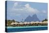 French Polynesia, Society Islands, Motu Tautau. Stilted Hotel Suites-Alida Latham-Stretched Canvas