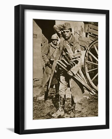 French soldier with wooden crosses to be placed on temporary graves, World War I, c1914-c1918-Unknown-Framed Photographic Print