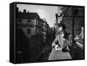 French Writer Albert Camus Smoking Cigarette on Balcony Outside His Publishing Firm Office-Loomis Dean-Framed Stretched Canvas