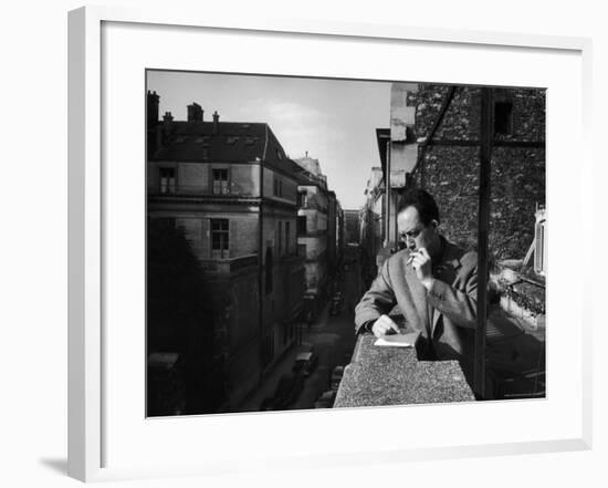 French Writer Albert Camus Smoking Cigarette on Balcony Outside His Publishing Firm Office-Loomis Dean-Framed Premium Photographic Print