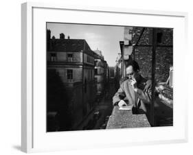 French Writer Albert Camus Smoking Cigarette on Balcony Outside His Publishing Firm Office-Loomis Dean-Framed Premium Photographic Print