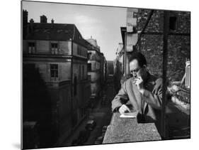 French Writer Albert Camus Smoking Cigarette on Balcony Outside His Publishing Firm Office-Loomis Dean-Mounted Premium Photographic Print