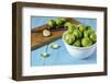 Fresh Brussels Sprouts in White Bowl on Turquoise Wooden Table-Jana Ihle-Framed Photographic Print