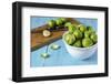Fresh Brussels Sprouts in White Bowl on Turquoise Wooden Table-Jana Ihle-Framed Photographic Print