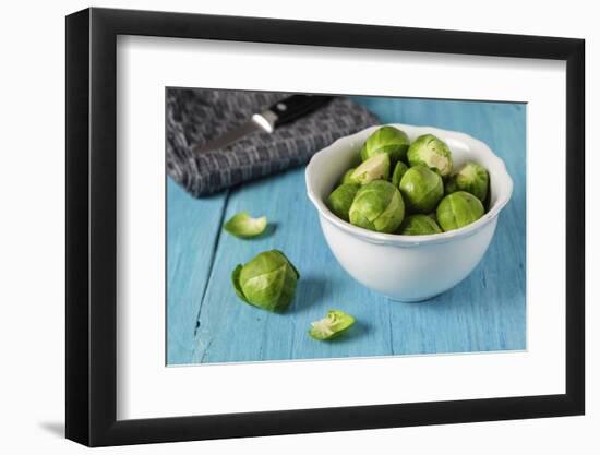 Fresh Brussels Sprouts in White Bowl on Turquoise Wooden Table-Jana Ihle-Framed Photographic Print