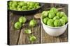 Fresh Brussels Sprouts in White Bowl on Wooden Table-Jana Ihle-Stretched Canvas