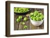 Fresh Brussels Sprouts in White Bowl on Wooden Table-Jana Ihle-Framed Photographic Print