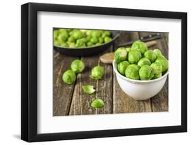 Fresh Brussels Sprouts in White Bowl on Wooden Table-Jana Ihle-Framed Photographic Print