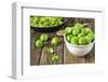 Fresh Brussels Sprouts in White Bowl on Wooden Table-Jana Ihle-Framed Photographic Print