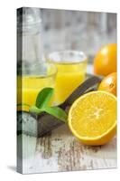 Fresh Pressed Orange Juice and Oranges-Jana Ihle-Stretched Canvas