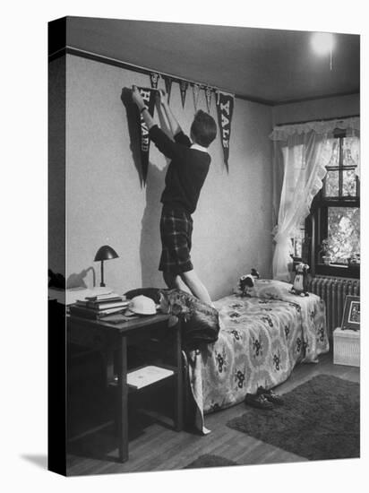 Freshman Mary Lloyd-Rees Hanging Both Harvard and Yale Banners in Her Room-Lisa Larsen-Stretched Canvas