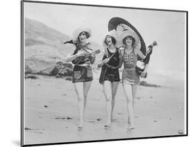 Frolicsome Trio of American Bathing Beauties Wearing the Latest Swimsuit Costumes-Emil Otto Hopp?-Mounted Photographic Print