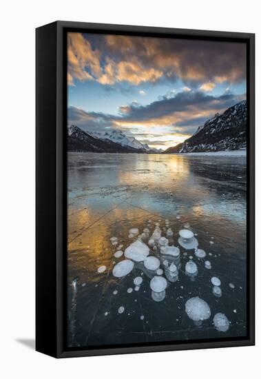 Frozen gas bubbles trapped in the ice at sunset. Silvaplana Lake, Silvaplana, Engadin, Graubunden,-ClickAlps-Framed Stretched Canvas