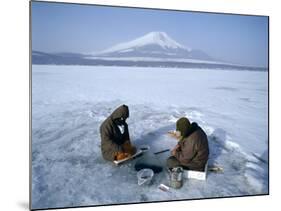 Frozen Lake with Fishermen, Lake Yamanaka, Mount Fuji, Honshu, Japan-null-Mounted Photographic Print