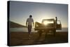 Full Length of Young Couple by Pick-Up Truck Parked on Beach-Nosnibor137-Stretched Canvas