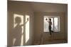 Full Length Rear View of Young Woman Cleaning Window in New Apartment-Nosnibor137-Mounted Photographic Print