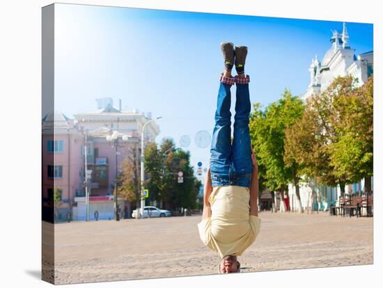 Fun Man Dancing. Has Yellow T-Shirt, Blue Jeans, Gray Shoes Sneakers, Slim Sport Body. Motion on Gr-ERainbow-Stretched Canvas