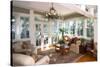 Furnished Sunroom with Large Windows and Glass Doors-Wollwerth Imagery-Stretched Canvas