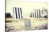 Furniture and Summer Holidays Concept - Two Beach Lounges with Beach Bag and White Hat on the Beach-dolgachov-Stretched Canvas