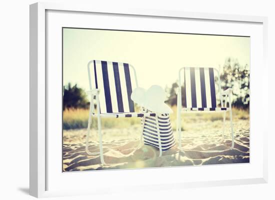 Furniture and Summer Holidays Concept - Two Beach Lounges with Beach Bag and White Hat on the Beach-dolgachov-Framed Photographic Print