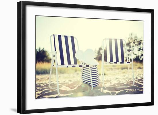 Furniture and Summer Holidays Concept - Two Beach Lounges with Beach Bag and White Hat on the Beach-dolgachov-Framed Photographic Print