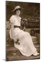 Gabrielle Ray, English Actress, with a Dog in a Garden-null-Mounted Photographic Print