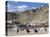 Game of Polo on Leh Polo Field, Tsemo Gompa on Ridge Behind, Leh, Ladakh, India-Tony Waltham-Stretched Canvas