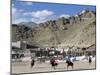 Game of Polo on Leh Polo Field, Tsemo Gompa on Ridge Behind, Leh, Ladakh, India-Tony Waltham-Mounted Photographic Print