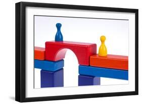 Gaming Pieces and Building Blocks Symbolising Breaking Down Barriers-Catharina Lux-Framed Photographic Print