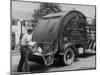 Garbage Man Emptying Trash into Back of Garbage Truck-Alfred Eisenstaedt-Mounted Photographic Print