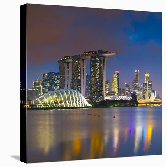 Gardens by the Bay and Marina Bay Sands Hotel, Singapore-Ian Trower-Stretched Canvas