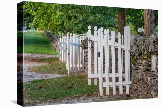 Gate and white wooden fence and rock wall, Shaker Village of Pleasant Hill, Harrodsburg, Kentucky-Adam Jones-Stretched Canvas