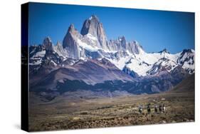 Gauchos Riding Horses and Herding Sheep with Mount Fitz Roy Behind, Patagonia, Argentina-Matthew Williams-Ellis-Stretched Canvas