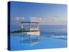 Gazebo Reflecting on Pool with Sea in Background, Long Island, Bahamas-Kent Foster-Stretched Canvas